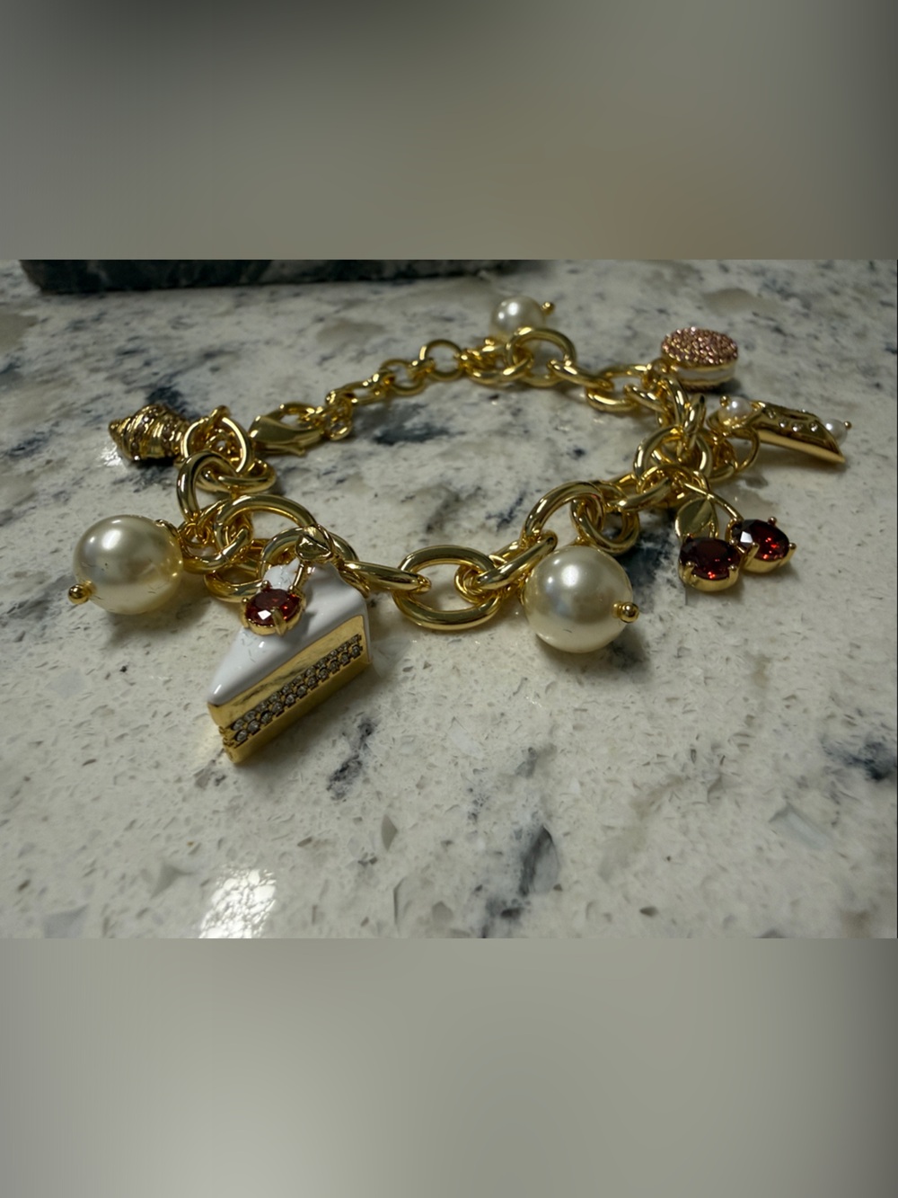 Gold-Tone pastry 🥐 Charm Bracelet with White Pearls and Red Crystal Accents